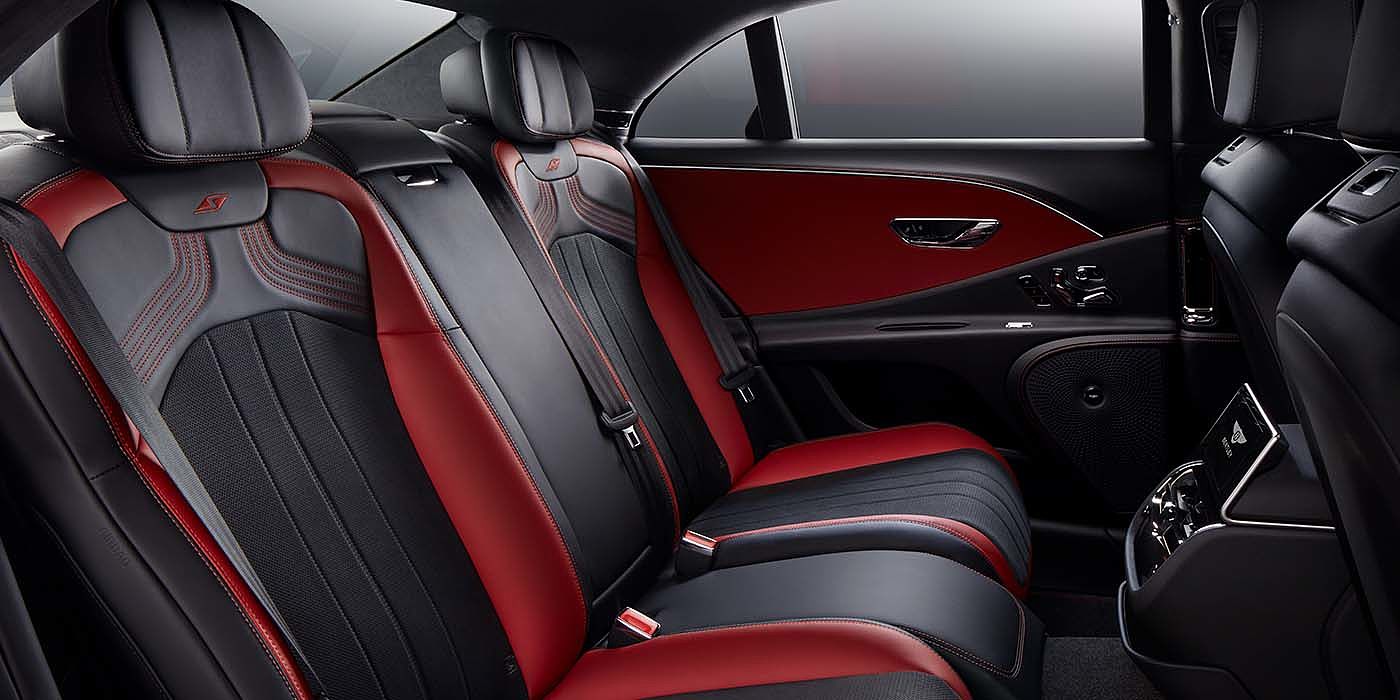 Bentley Madrid Bentley Flying Spur S sedan rear interior in Beluga black and Hotspur red hide with S stitching