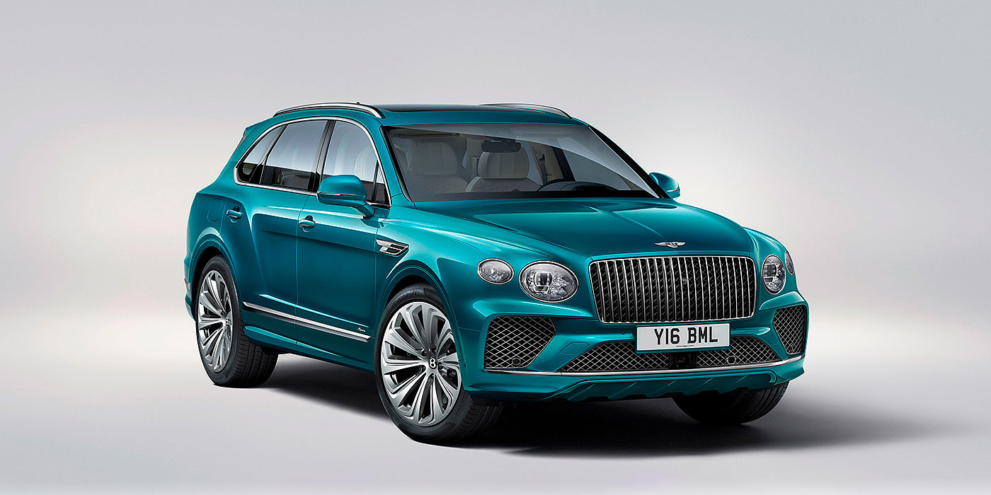 Bentley Madrid Bentley Bentayga Azure front three-quarter view, featuring a fluted chrome grille with a matrix lower grille and chrome accents in Topaz blue paint.
