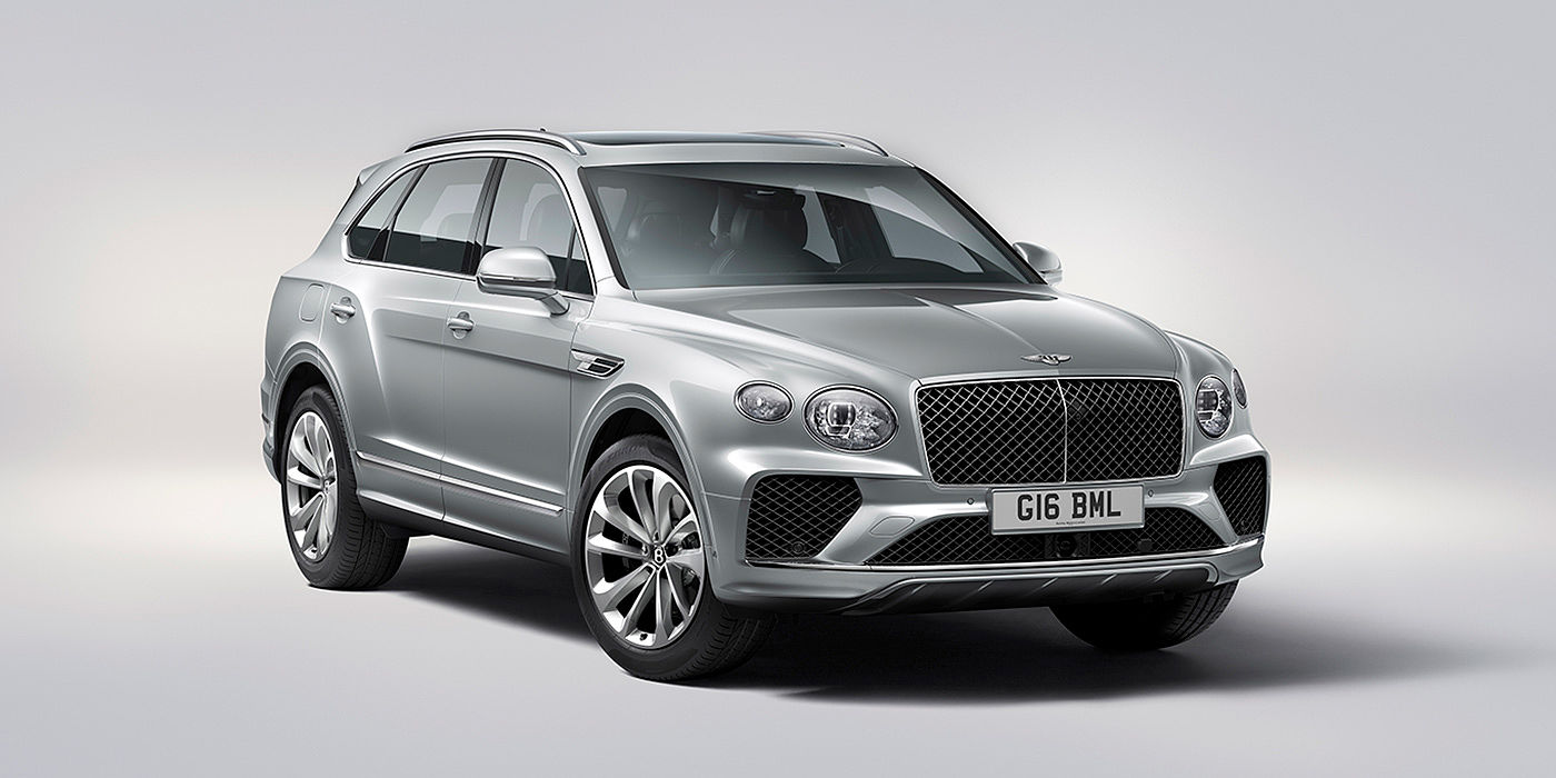 Bentley Madrid Bentley Bentayga in Moonbeam paint, front three-quarter view, featuring a matrix grille and elliptical LED headlights.