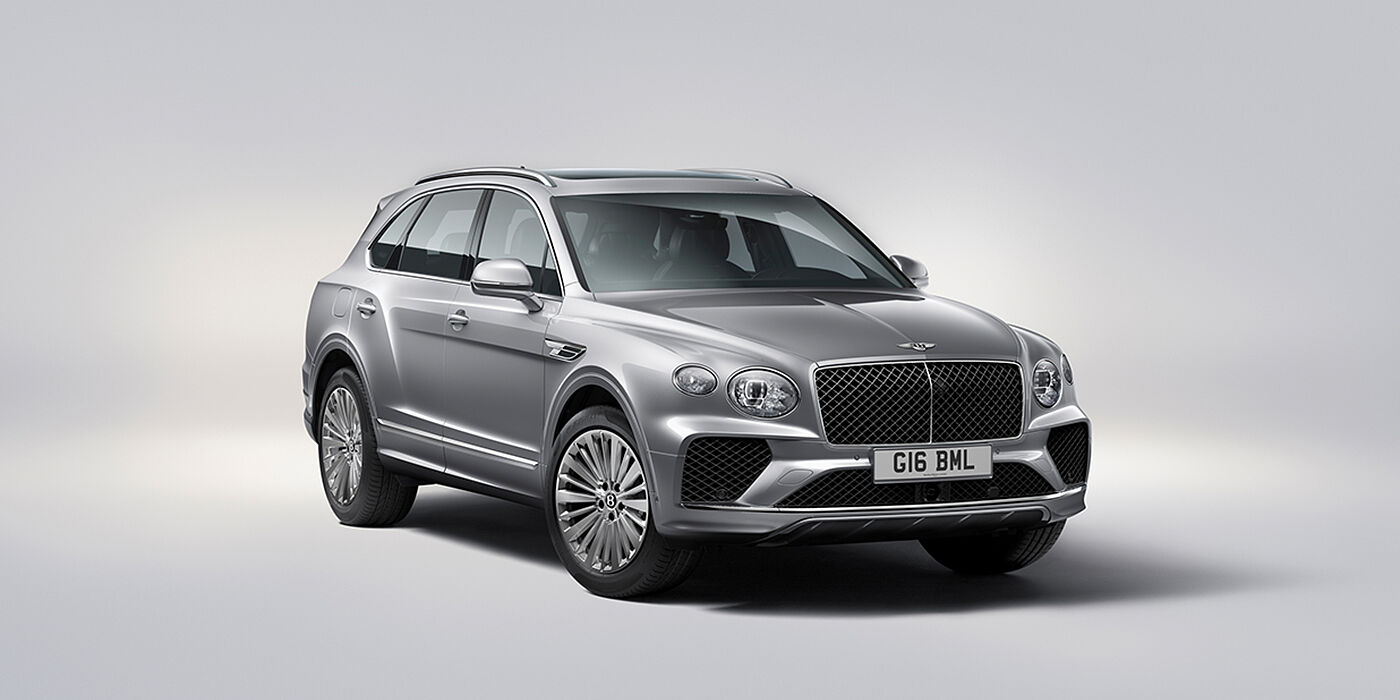Bentley Madrid Bentley Bentayga luxury SUV front three quarter view in Moonbeam paint with matrix grille and 21″ 5 spoke painted wheels