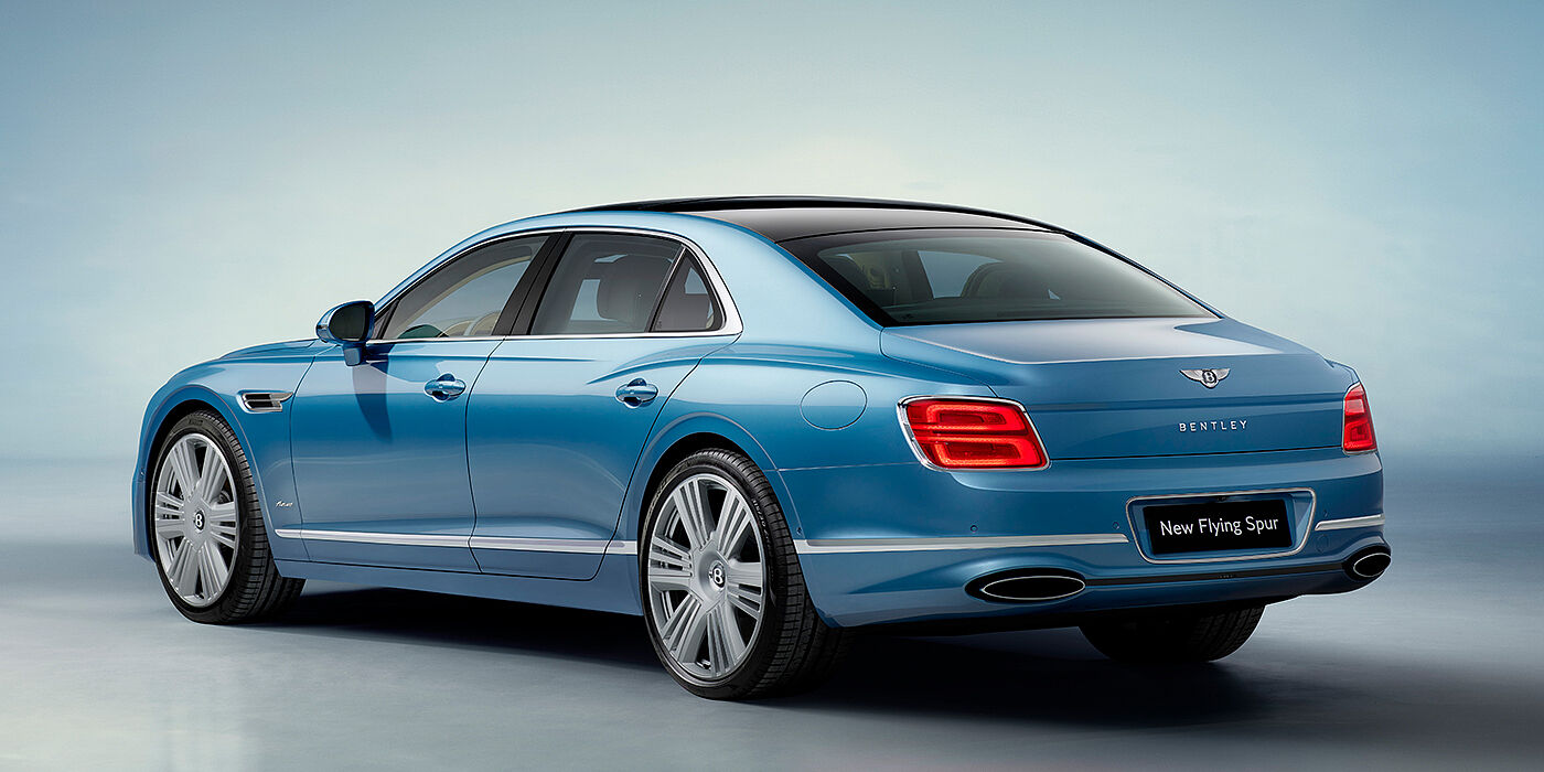 Bentley Madrid New Bentley Flying Spur Azure sedan rear view in Light windsor blue by Mulliner paint with 22 inch Azure wheels and chrome exterior details