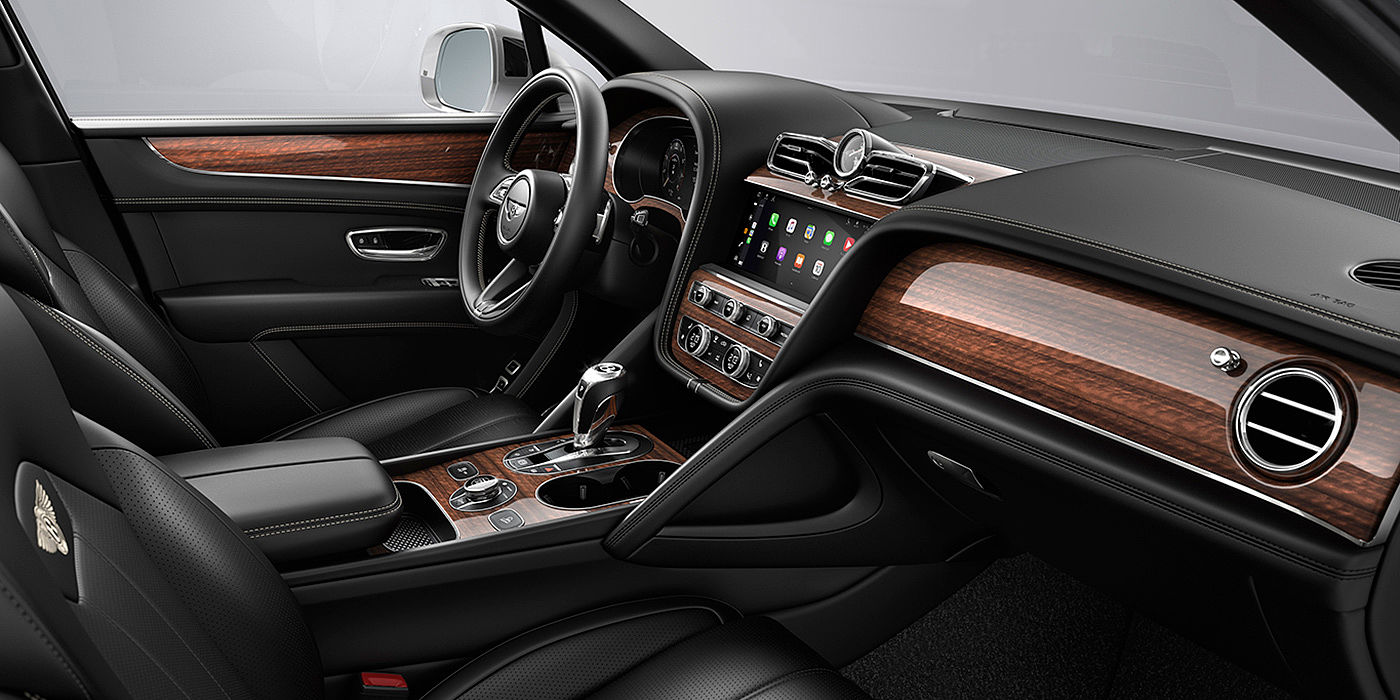 Bentley Madrid Bentley Bentayga interior with a Crown Cut Walnut veneer, view from the passenger seat over looking the driver's seat.