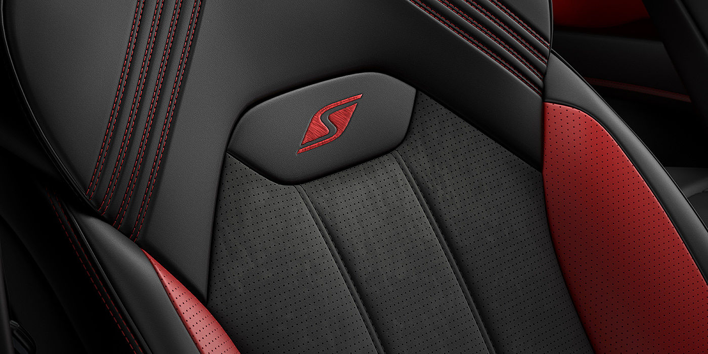 Bentley Madrid Bentley Bentayga S seat with detailed red Hotspur stitching and black Beluga coloured hide. 