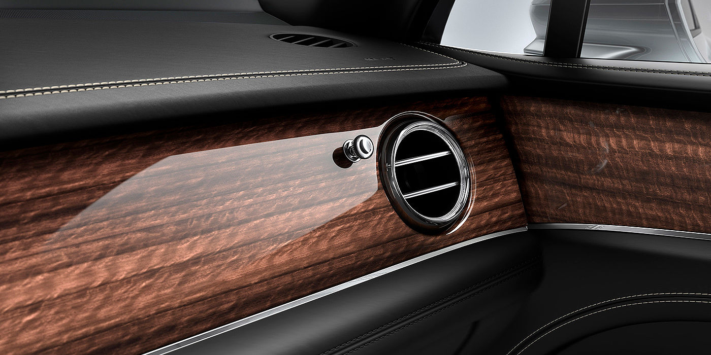 Bentley Madrid Bentley Bentayga front interior Crown Cut Walnut veneer and chrome air vent.