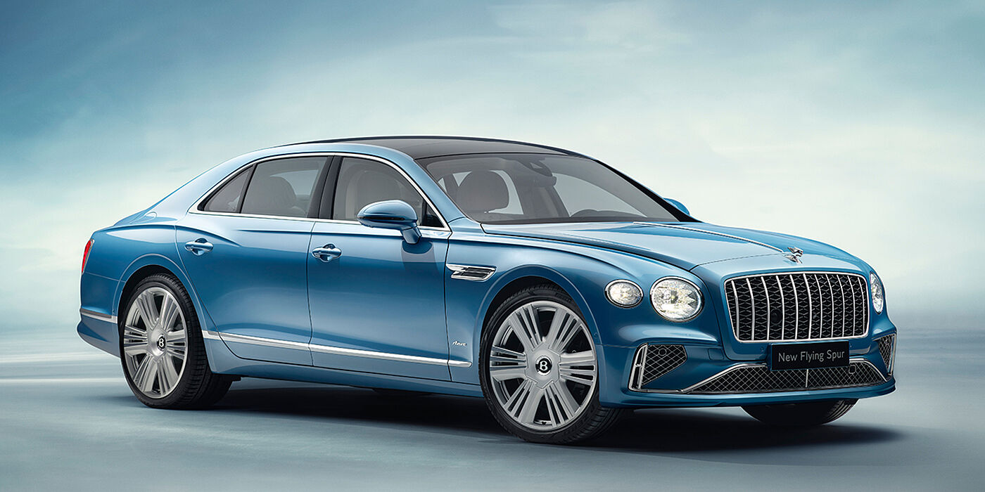 Bentley Madrid New Bentley Flying Spur Azure sedan front view in Light windsor blue by Mulliner paint with 22 inch Azure wheels and chrome exterior details