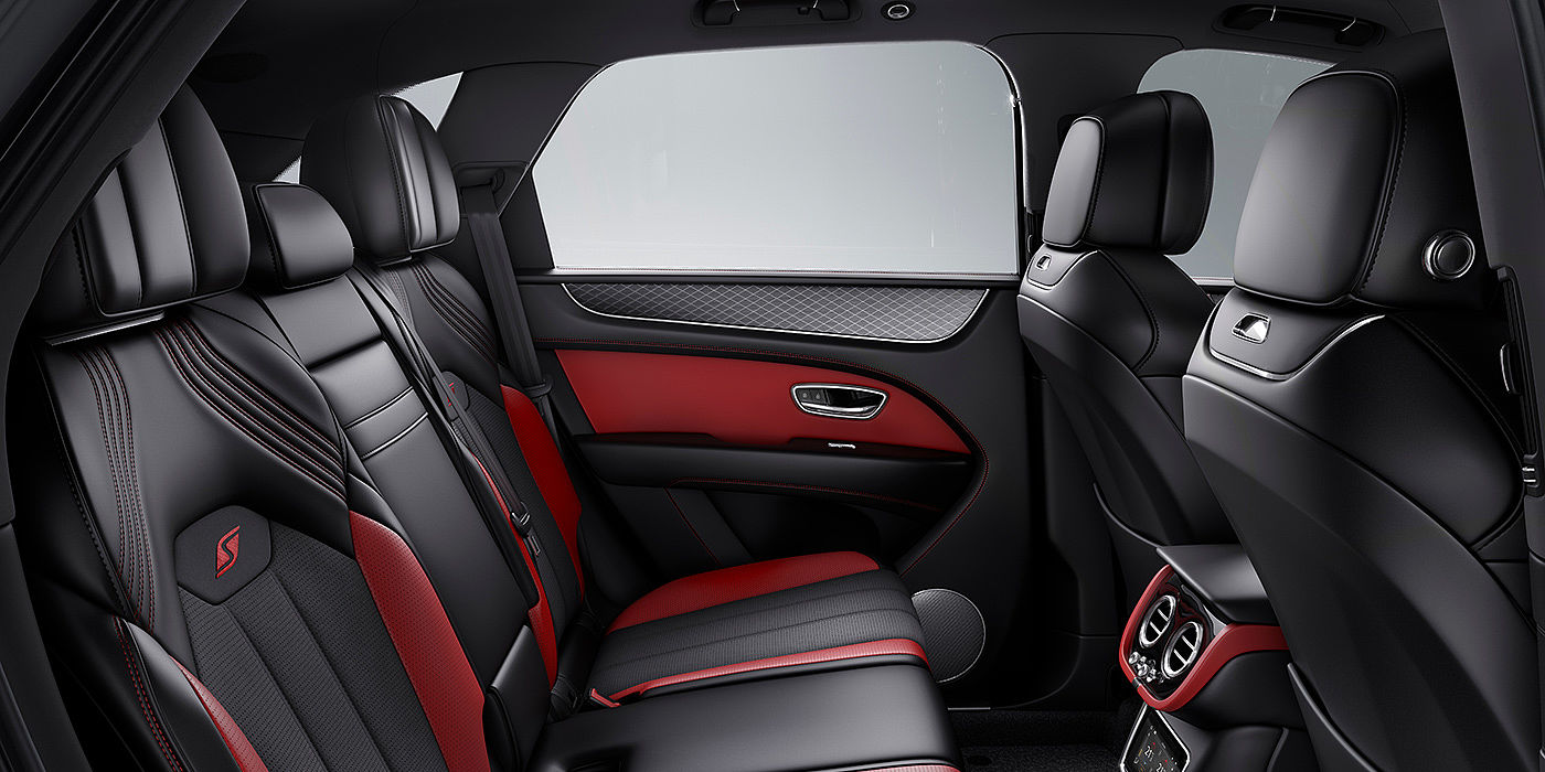 Bentley Madrid Bentey Bentayga S interior view for rear passengers with Beluga black and Hotspur red coloured hide.