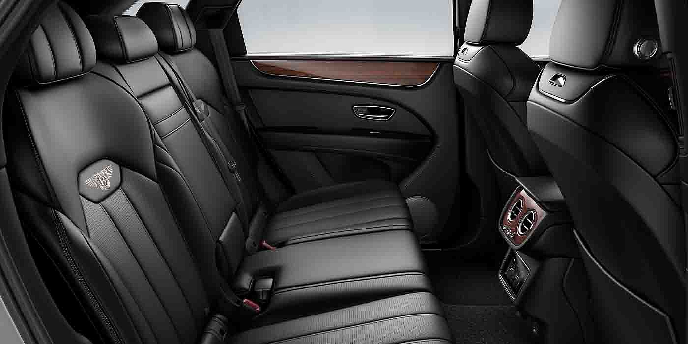 Bentley Madrid Bentley Bentayga EWB interior view for rear passengers with Beluga black hide.