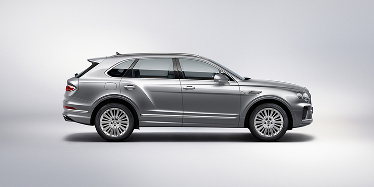 Bentley Madrid Bentley Bentayga SUV side profile in Moonbeam silver paint against white background featuring 21 inch 5 spoke wheels